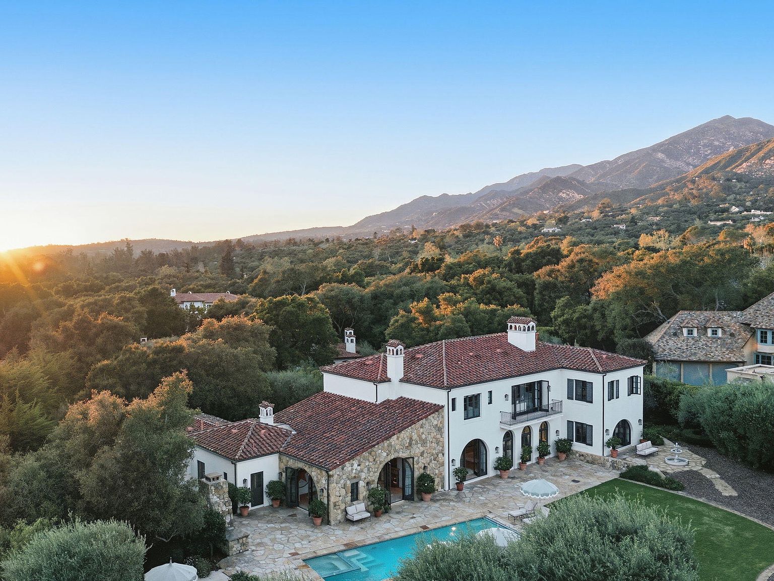 Aerial view of the estate at sunset with Santa Ynez mountains rising behind